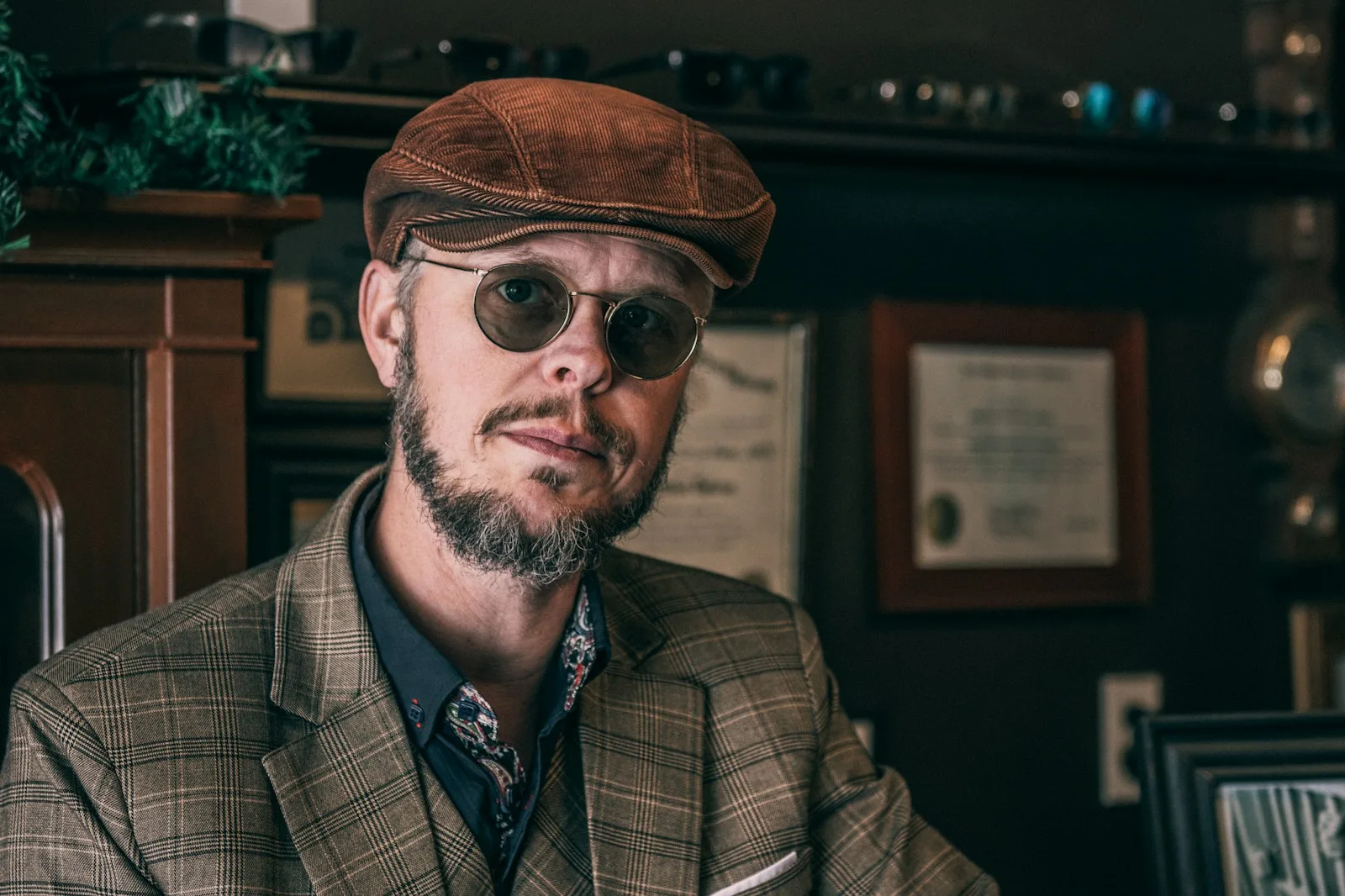 man in brown hat and black sunglasses